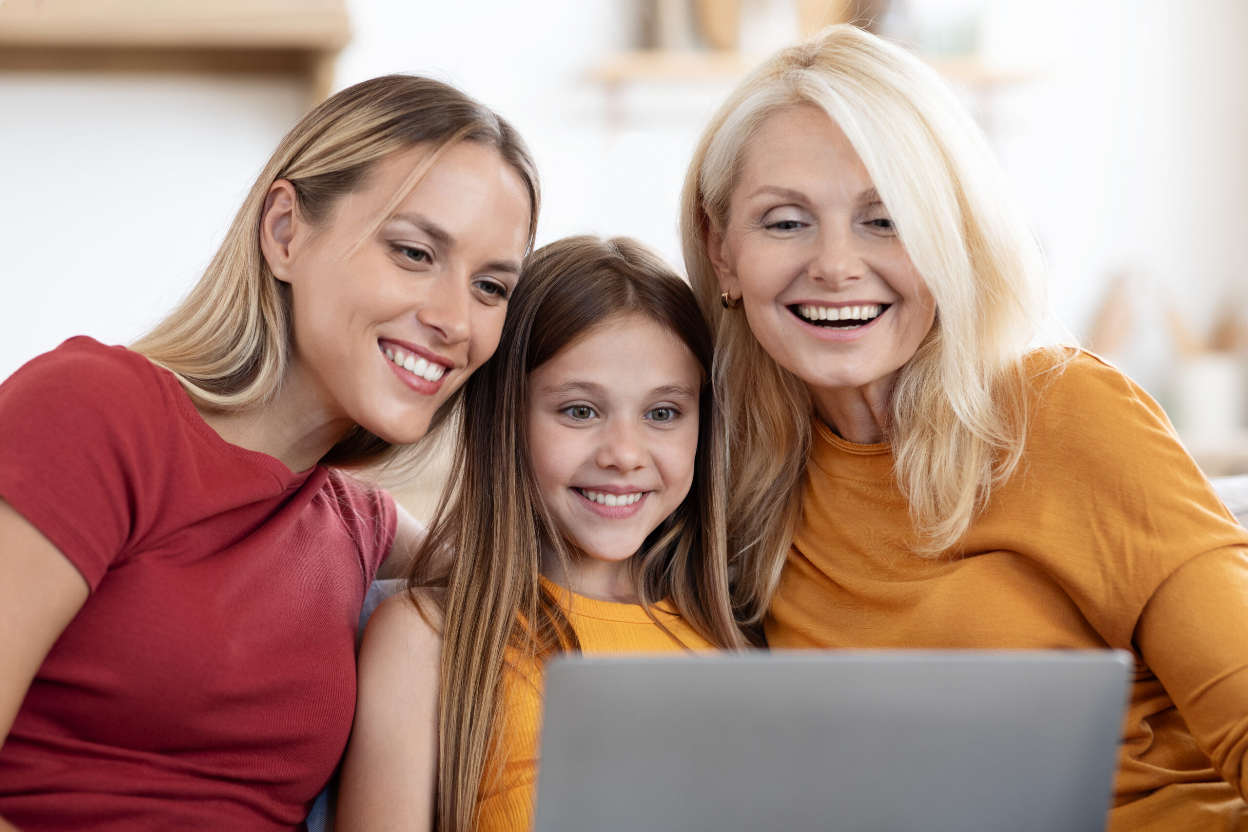 Mother and daughter smiling together after dental care