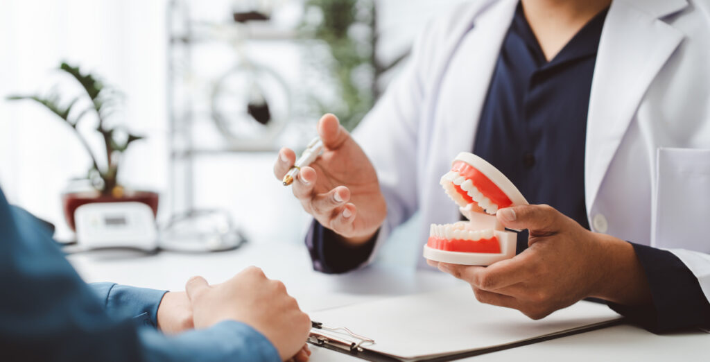 Oral surgery consultation discussing treatment options with a patient