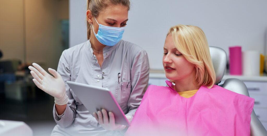 Oral surgery consultation between a dental professional and patient