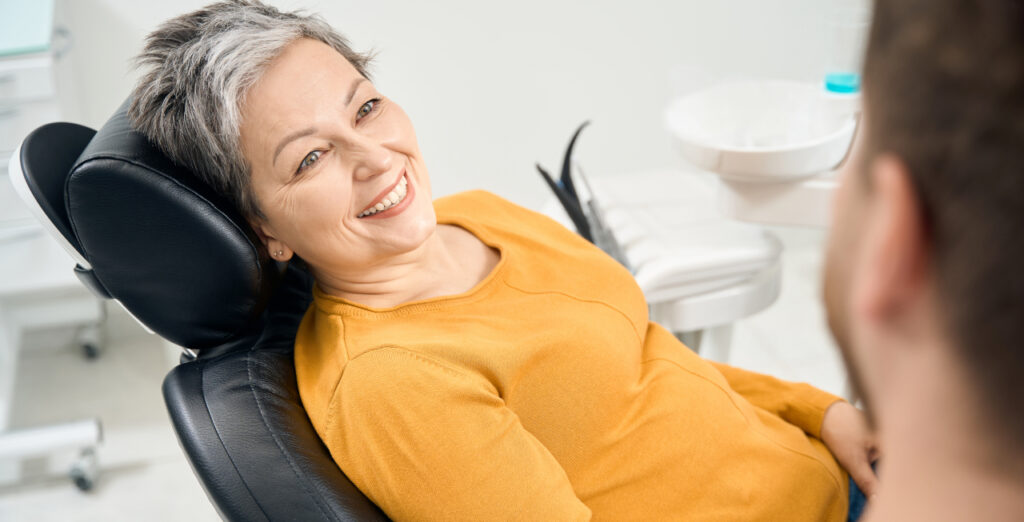 Senior woman receiving care during a wisdom tooth removal procedure