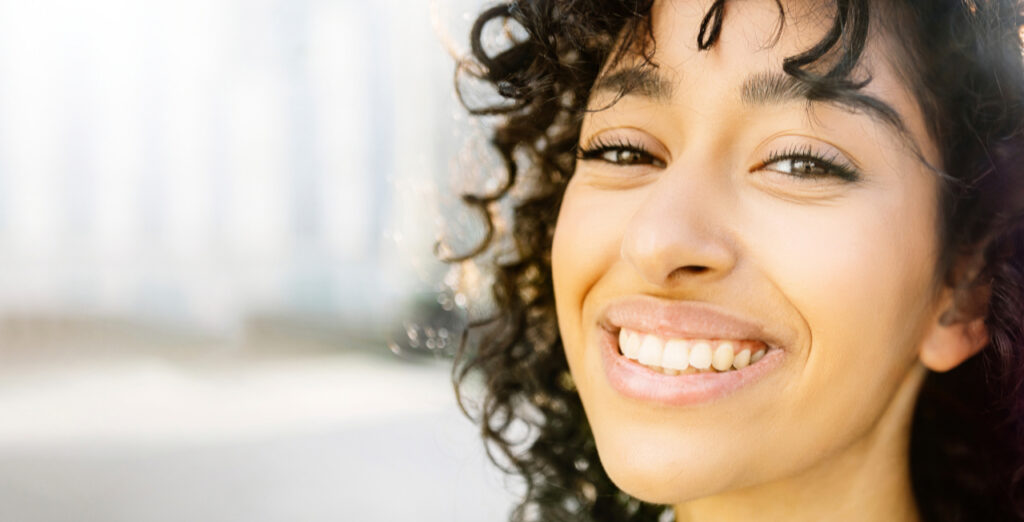 Smilng Woman With Curly Hair